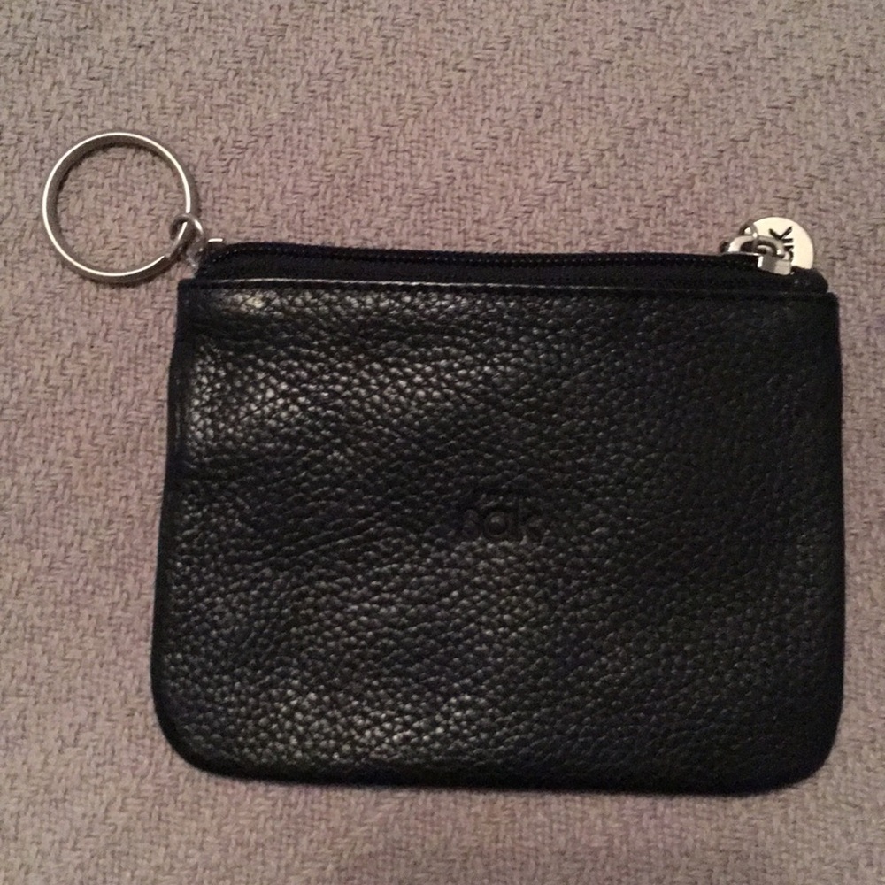 Small black leather coin case by The Sak
